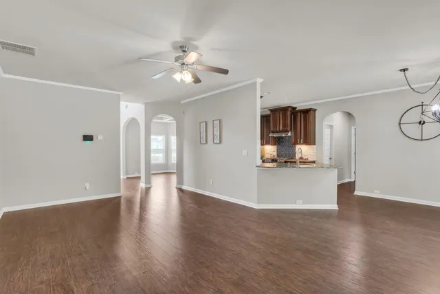 a view of a hallway with windows