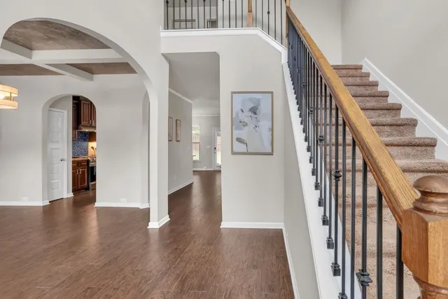 a view of an entryway with wooden floor