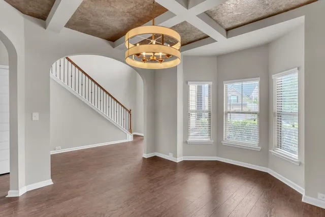 a view of an entryway with wooden floor