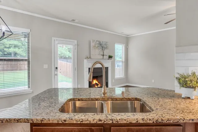 a kitchen with granite countertop a sink and a granite counter tops