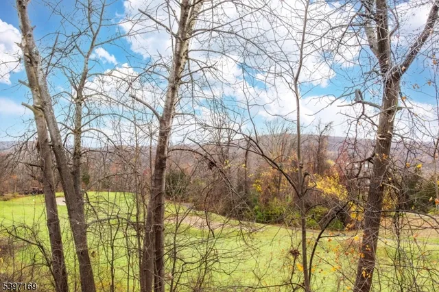 a view of a kitchen with wooden floor and a sink