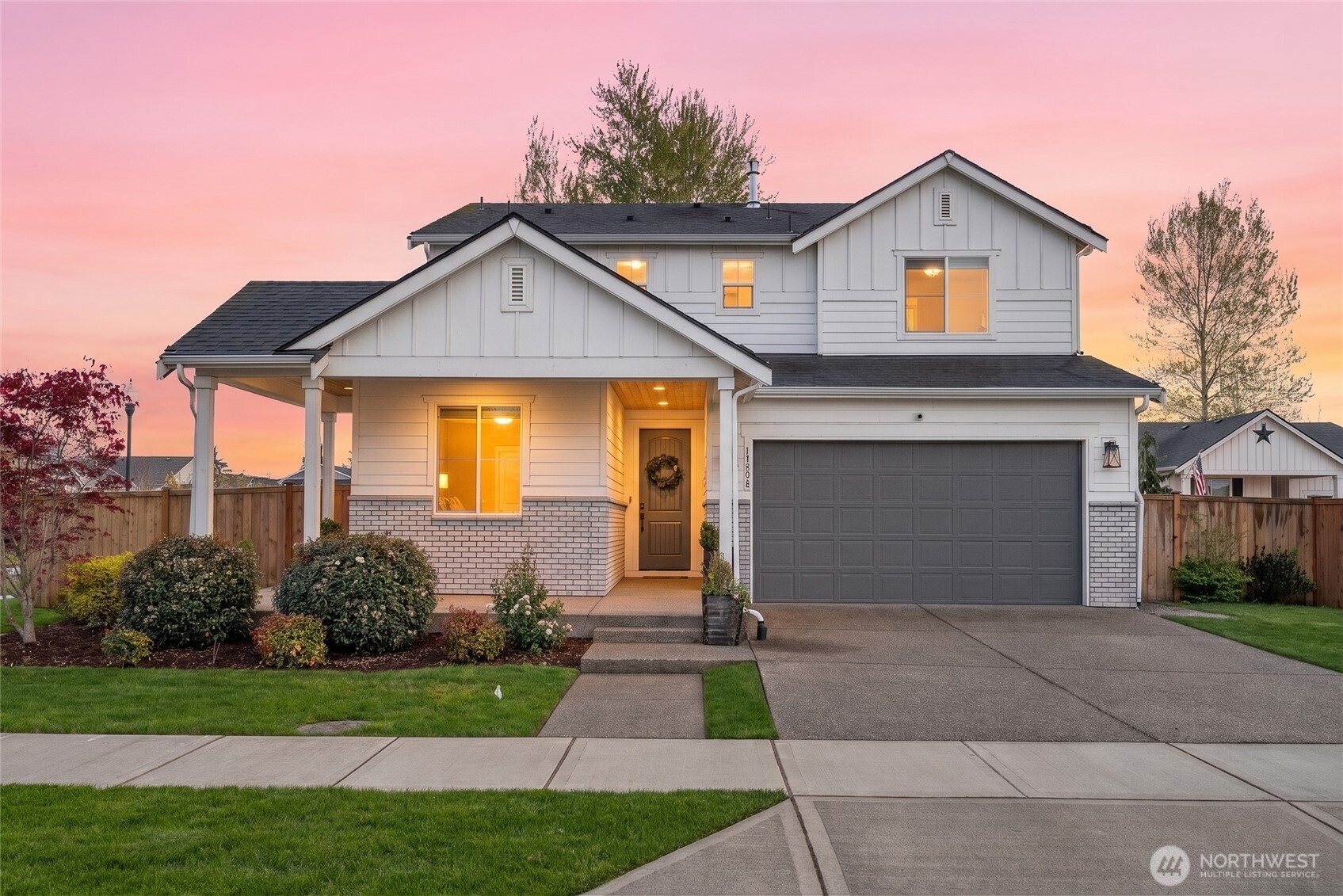 15696 Washington Street Sumner, WA 98390 - Photo 1 of 29 a front view of a house with garden
