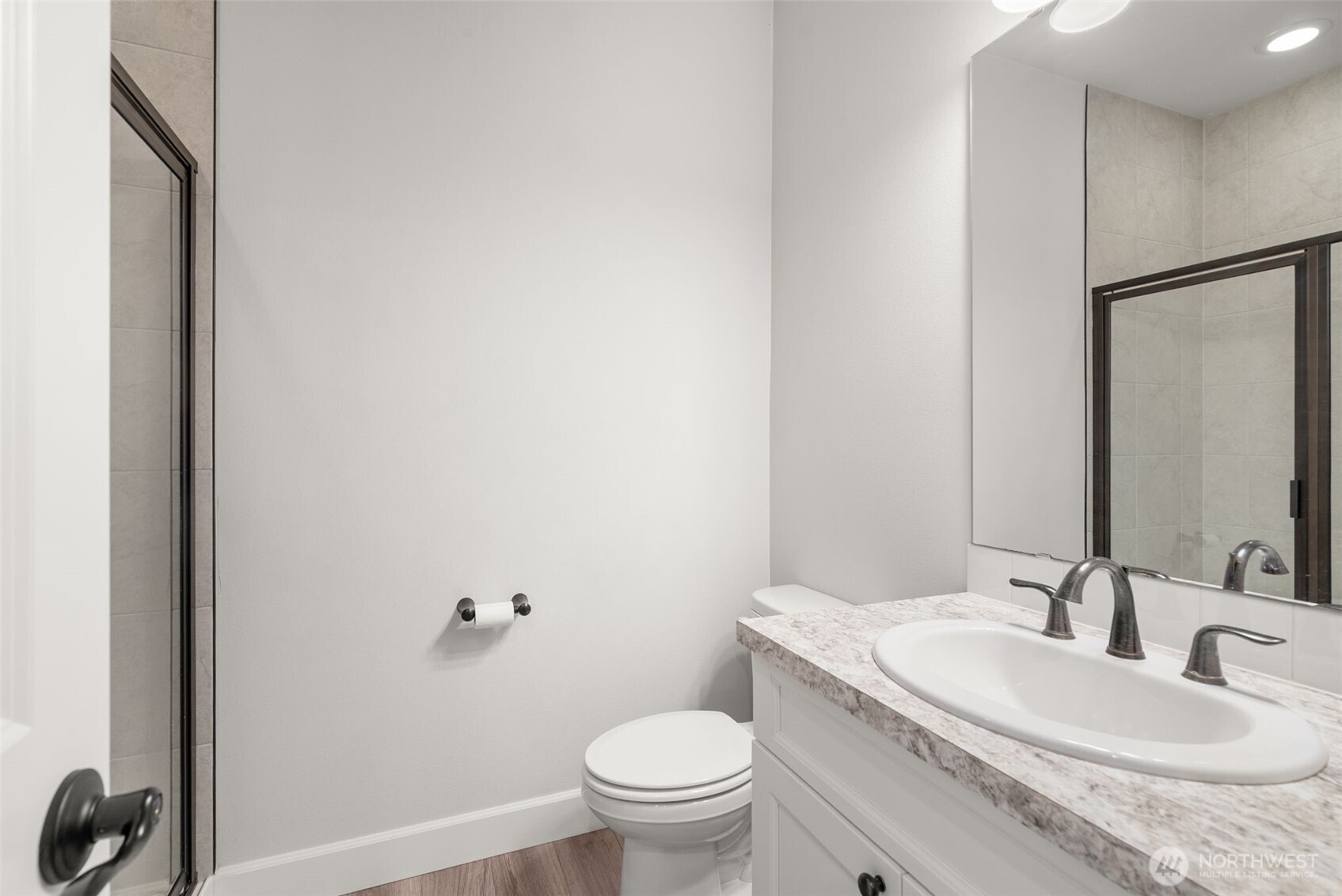 15696 Washington Street Sumner, WA 98390 - Photo 14 of 29 a bathroom with a granite countertop sink toilet and a mirror