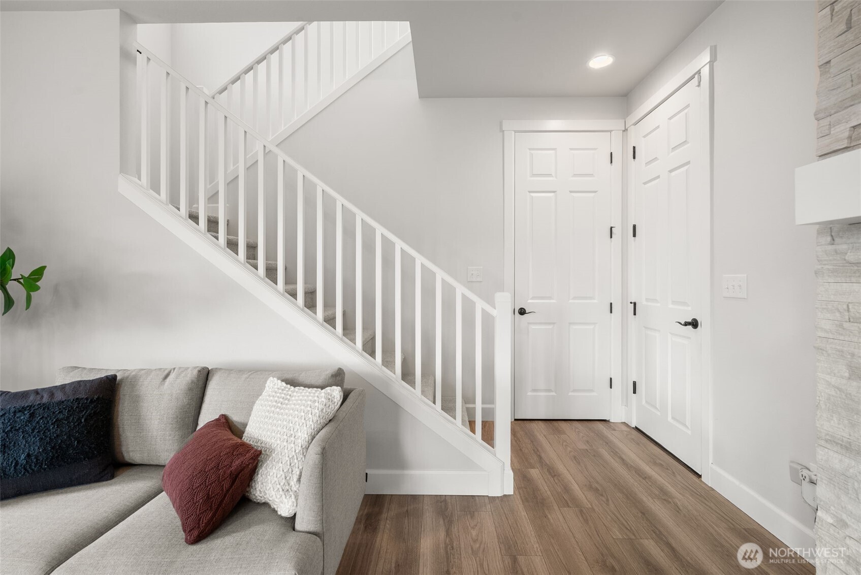 15696 Washington Street Sumner, WA 98390 - Photo 15 of 29 a view of hallway with stairs and wooden floor