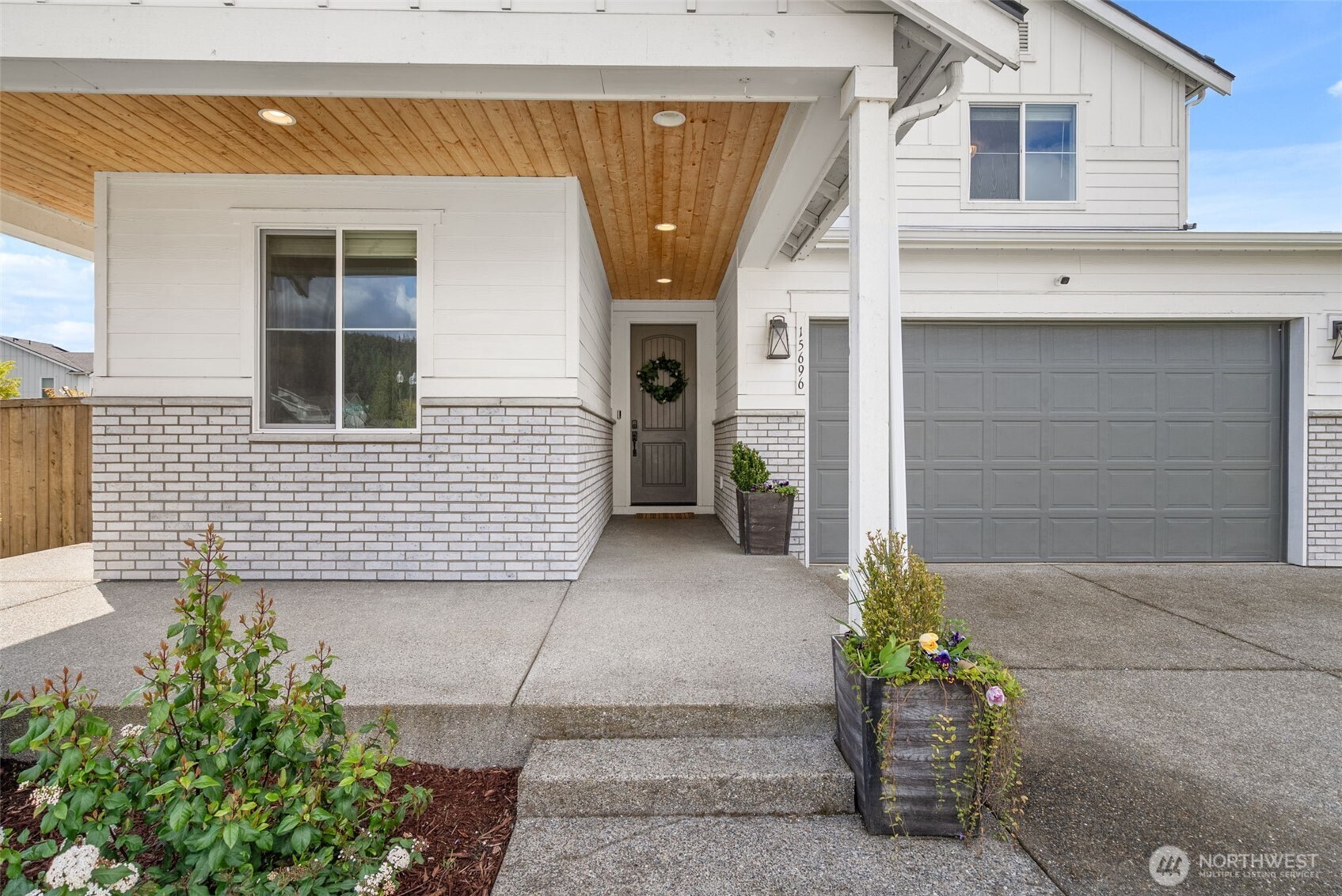 15696 Washington Street Sumner, WA 98390 - Photo 2 of 29 a view of a house with a garage and a chair