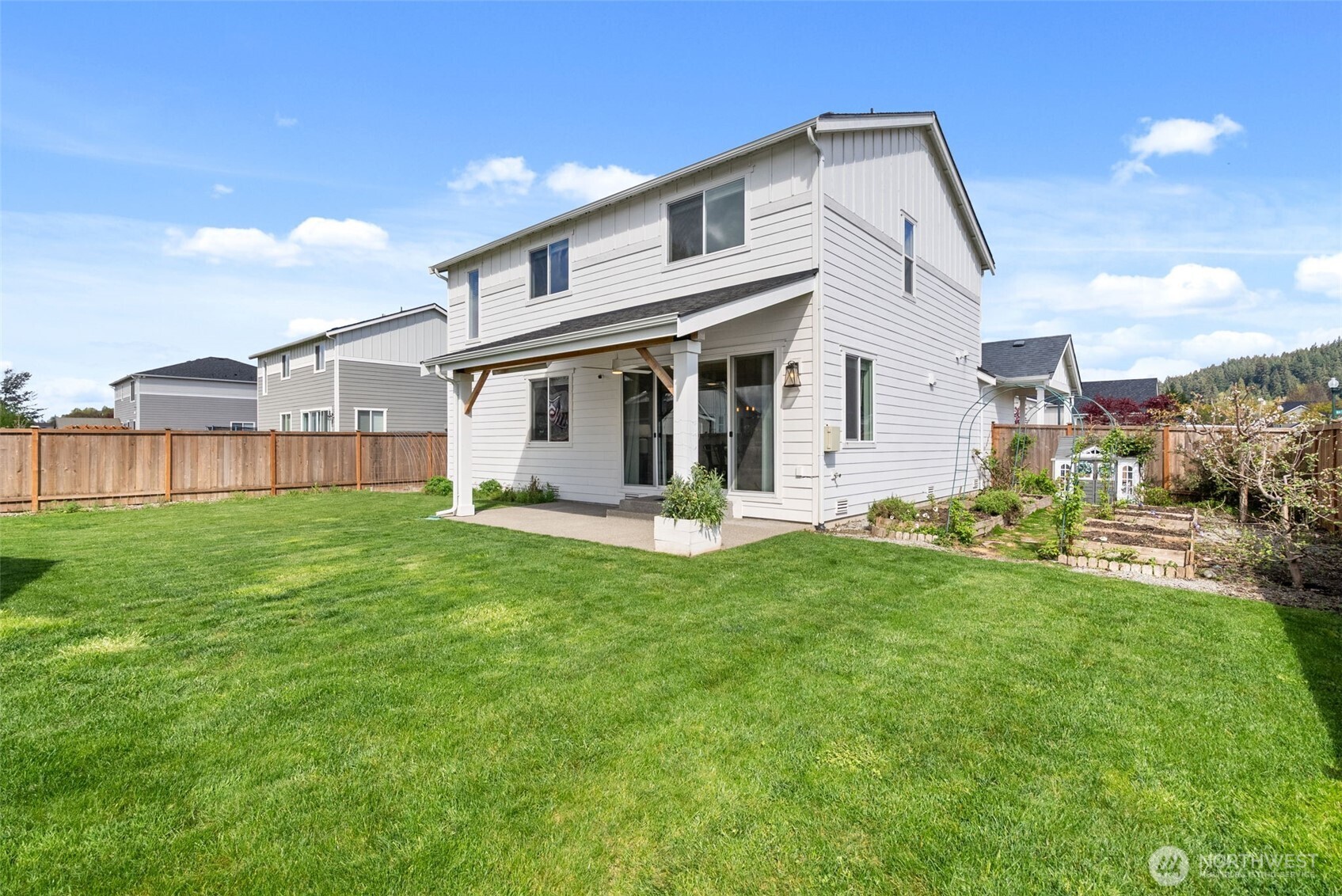15696 Washington Street Sumner, WA 98390 - Photo 23 of 29 a front view of a house with a yard and porch