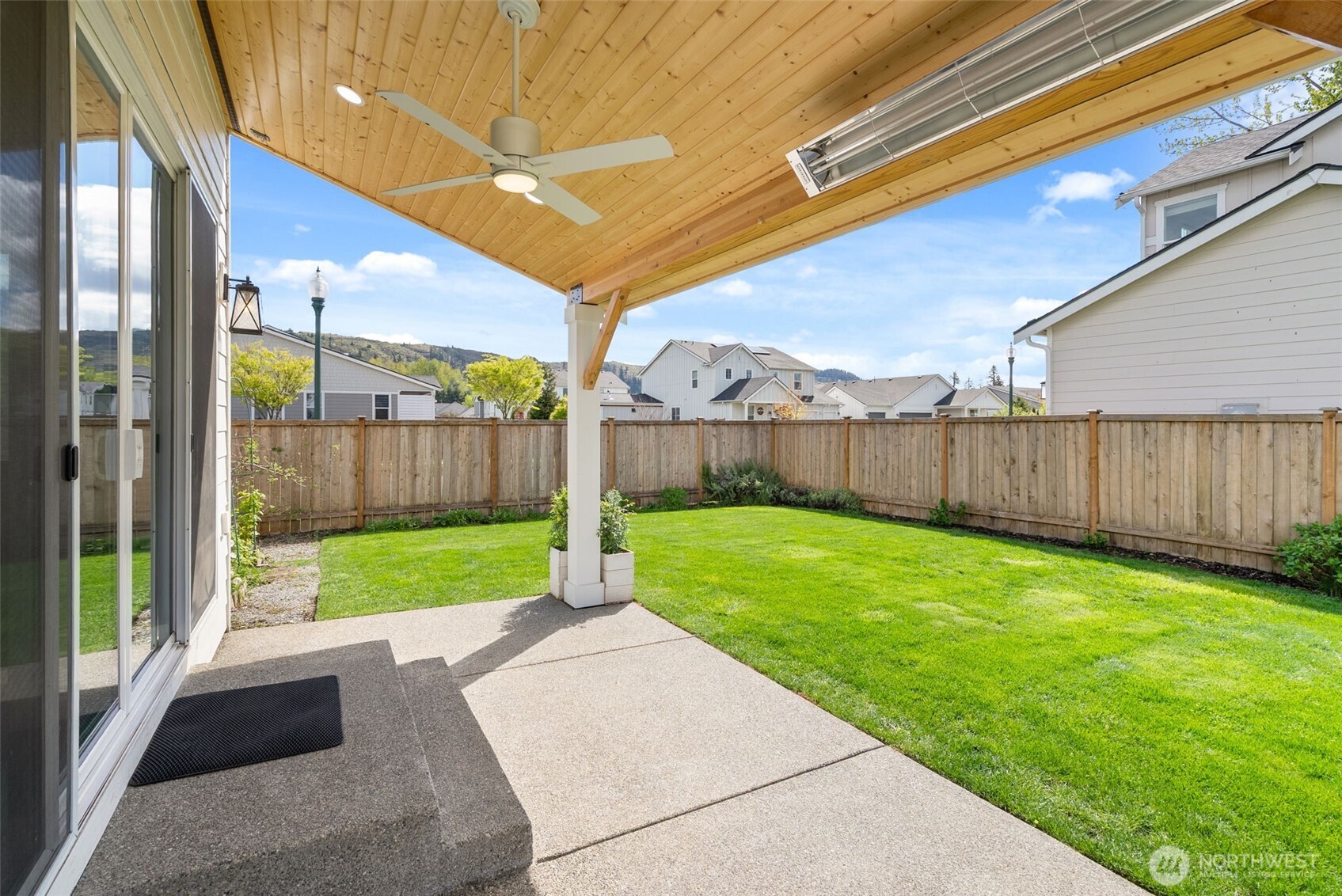 15696 Washington Street Sumner, WA 98390 - Photo 25 of 29 a view of a backyard with a car park
