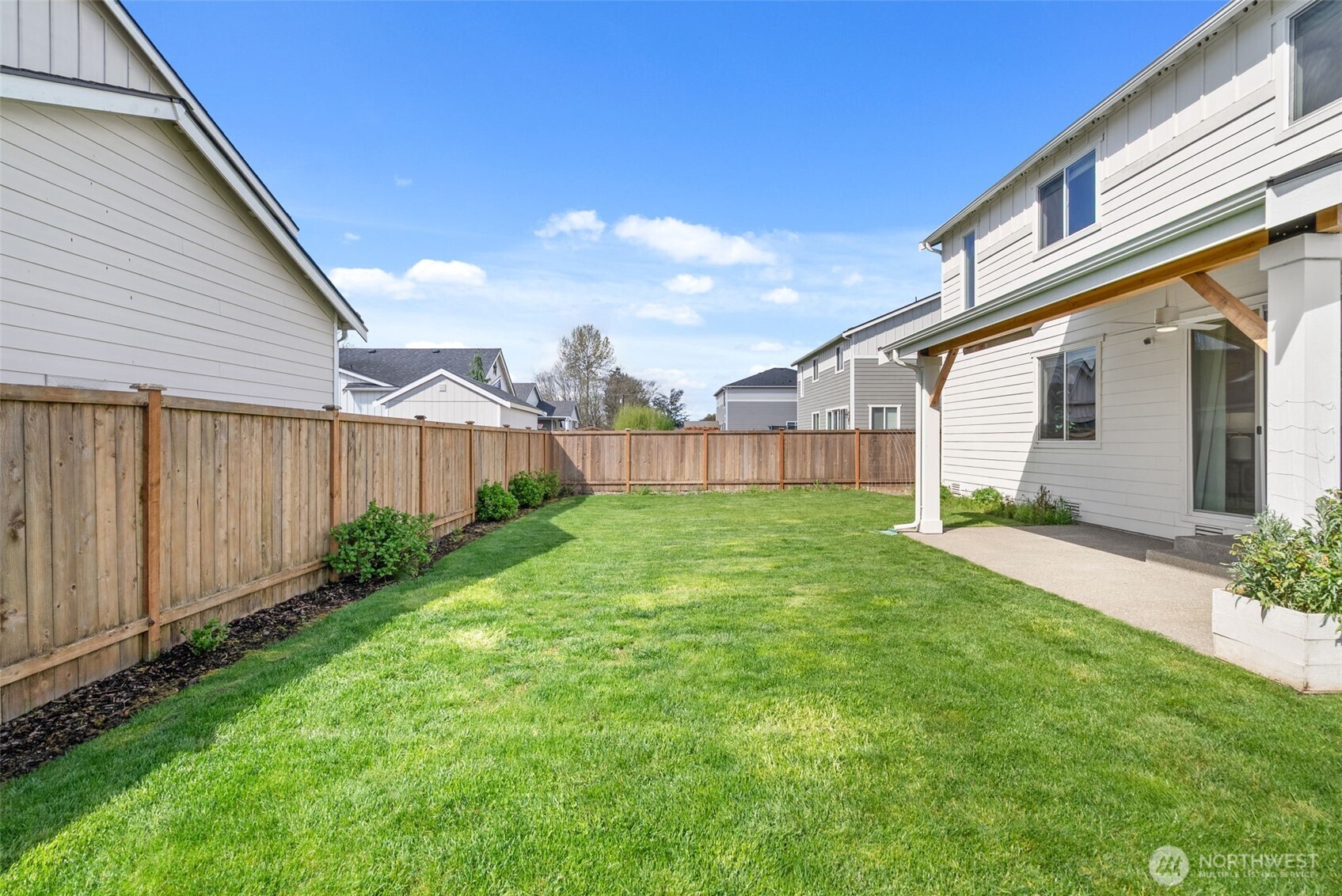 15696 Washington Street Sumner, WA 98390 - Photo 27 of 29 a view of a house with backyard and garden