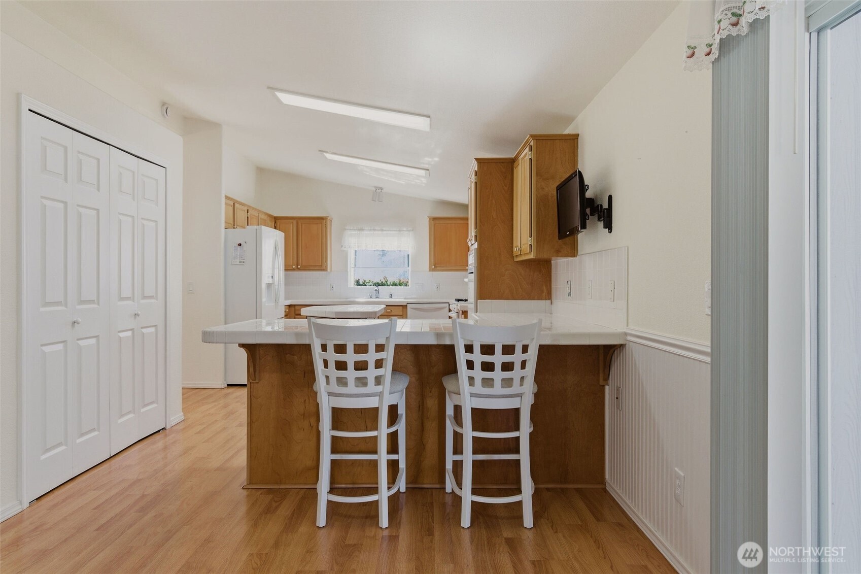24036 222nd Avenue Southeast Maple Valley, WA 98038 - Photo 12 of 37 a dining room with furniture and wooden floor