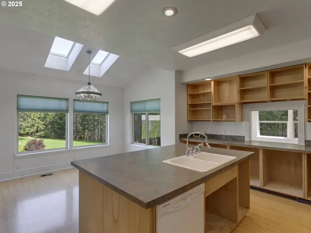 a kitchen with a sink and a window
