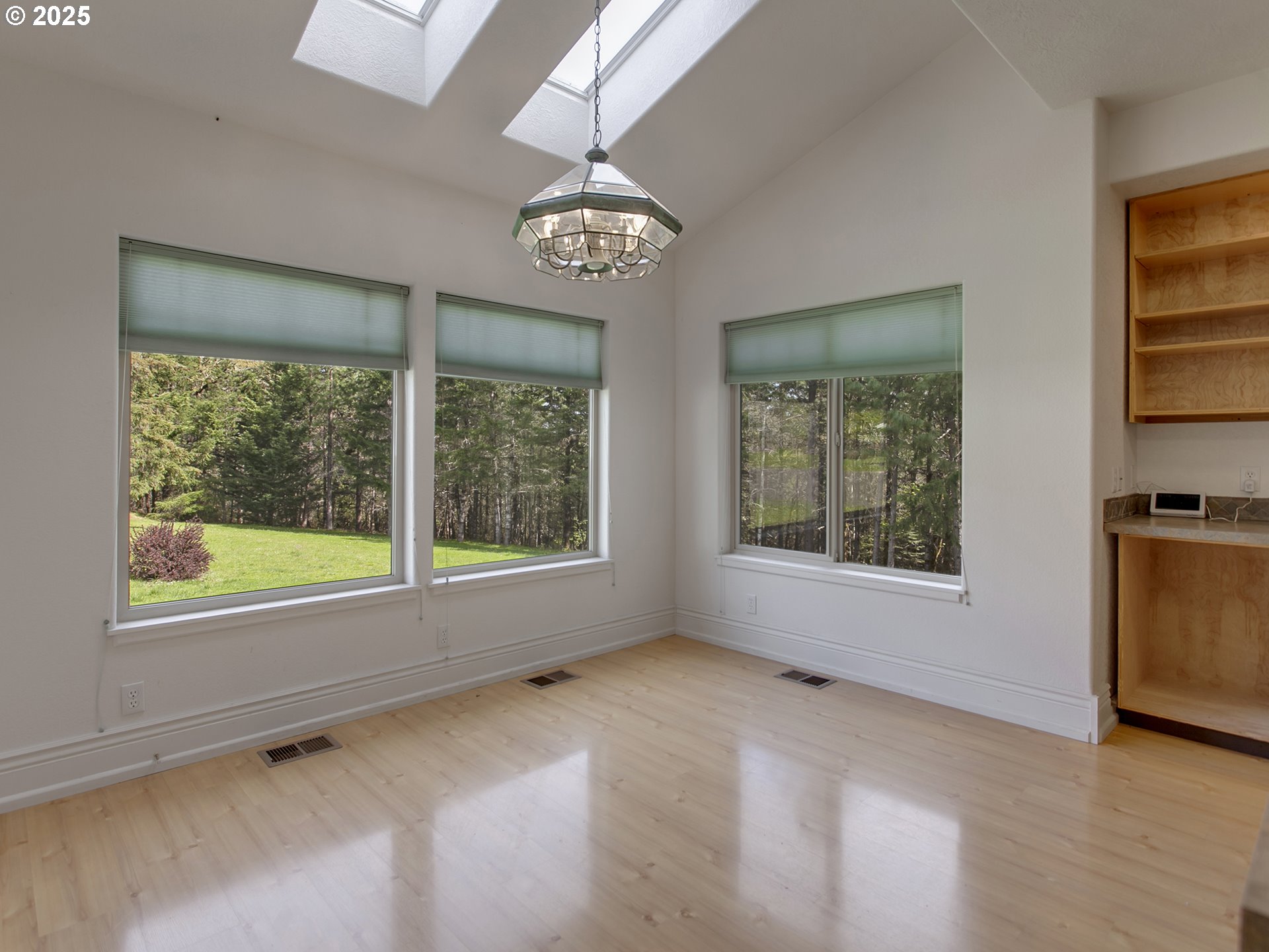17234 Oakdale Road Dallas, OR 97338 - Photo 14 of 45 a view of an empty room with a window and wooden floor