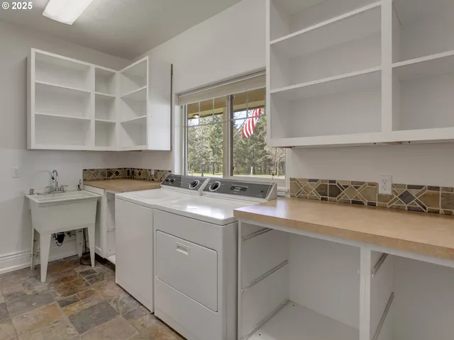 a kitchen with a sink and a stove