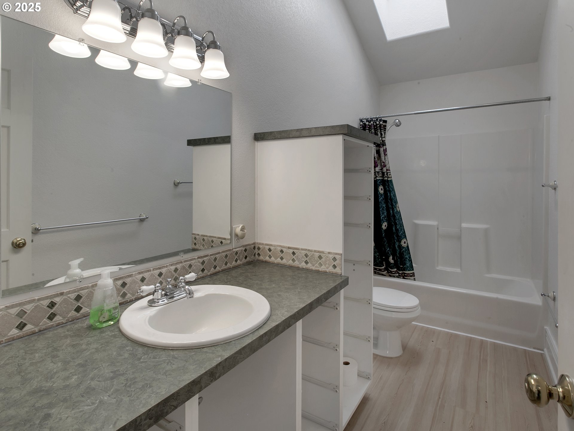 17234 Oakdale Road Dallas, OR 97338 - Photo 26 of 45 a bathroom with a sink a toilet and shower