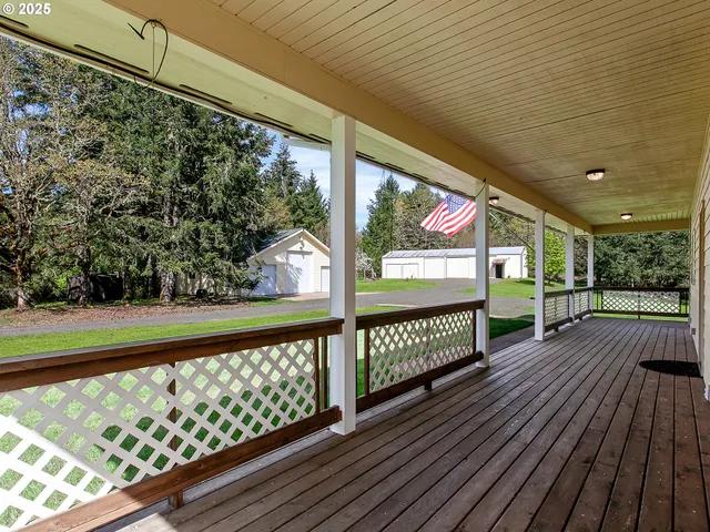 a view of balcony with wooden floor