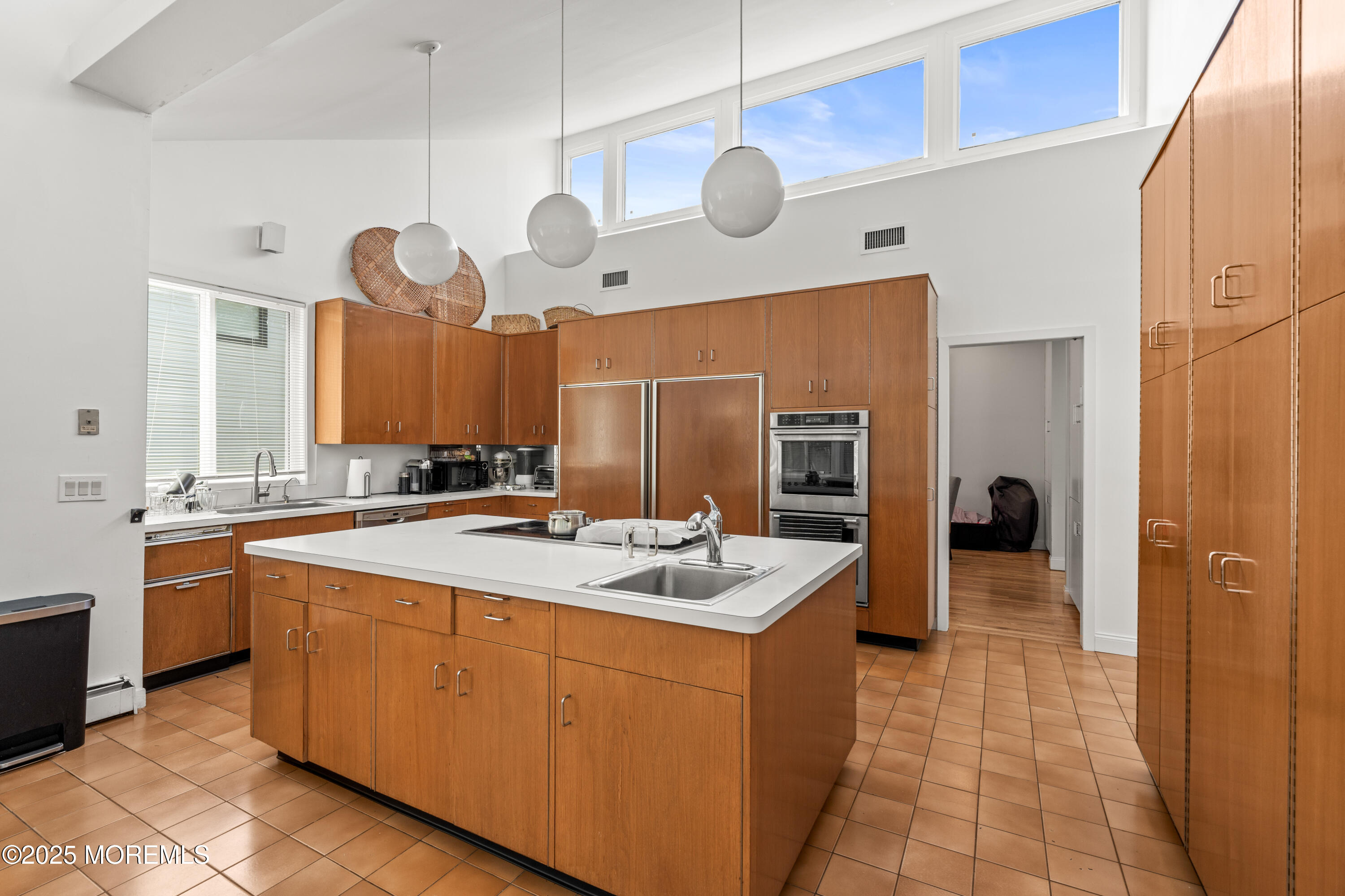 460 Runyan Avenue Deal, NJ 07723 - Photo 13 of 30 a large kitchen with a large counter space and stainless steel appliances