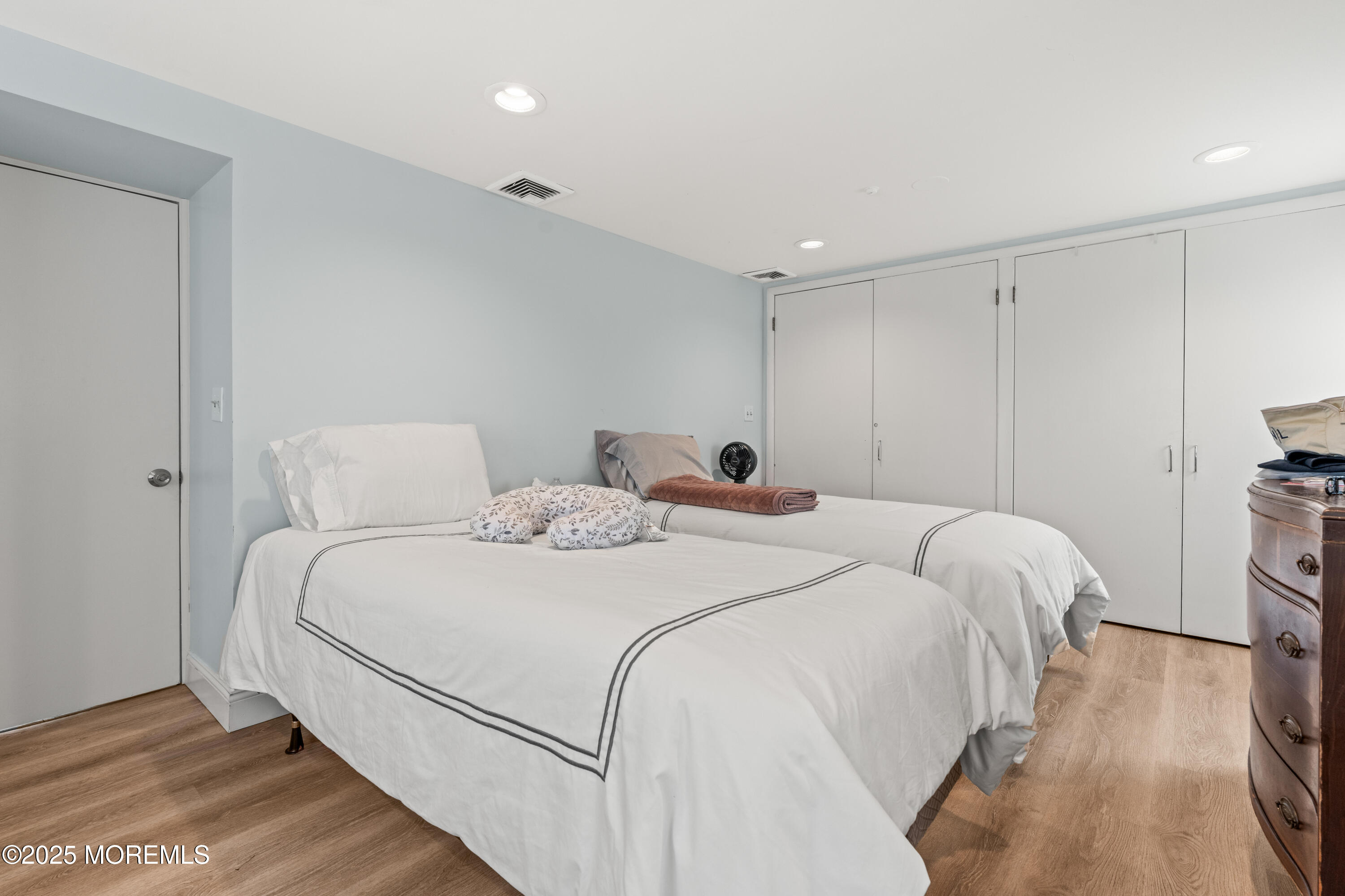 460 Runyan Avenue Deal, NJ 07723 - Photo 21 of 30 a bedroom with bed and a night stand