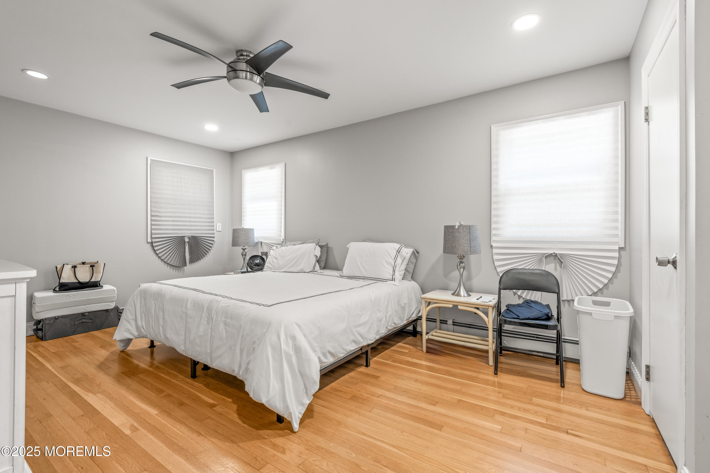 460 Runyan Avenue Deal, NJ 07723 - Photo 22 of 30 a bedroom with a bed and a chair