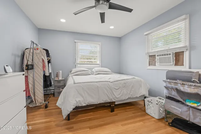 a bed sitting in a room next to a window