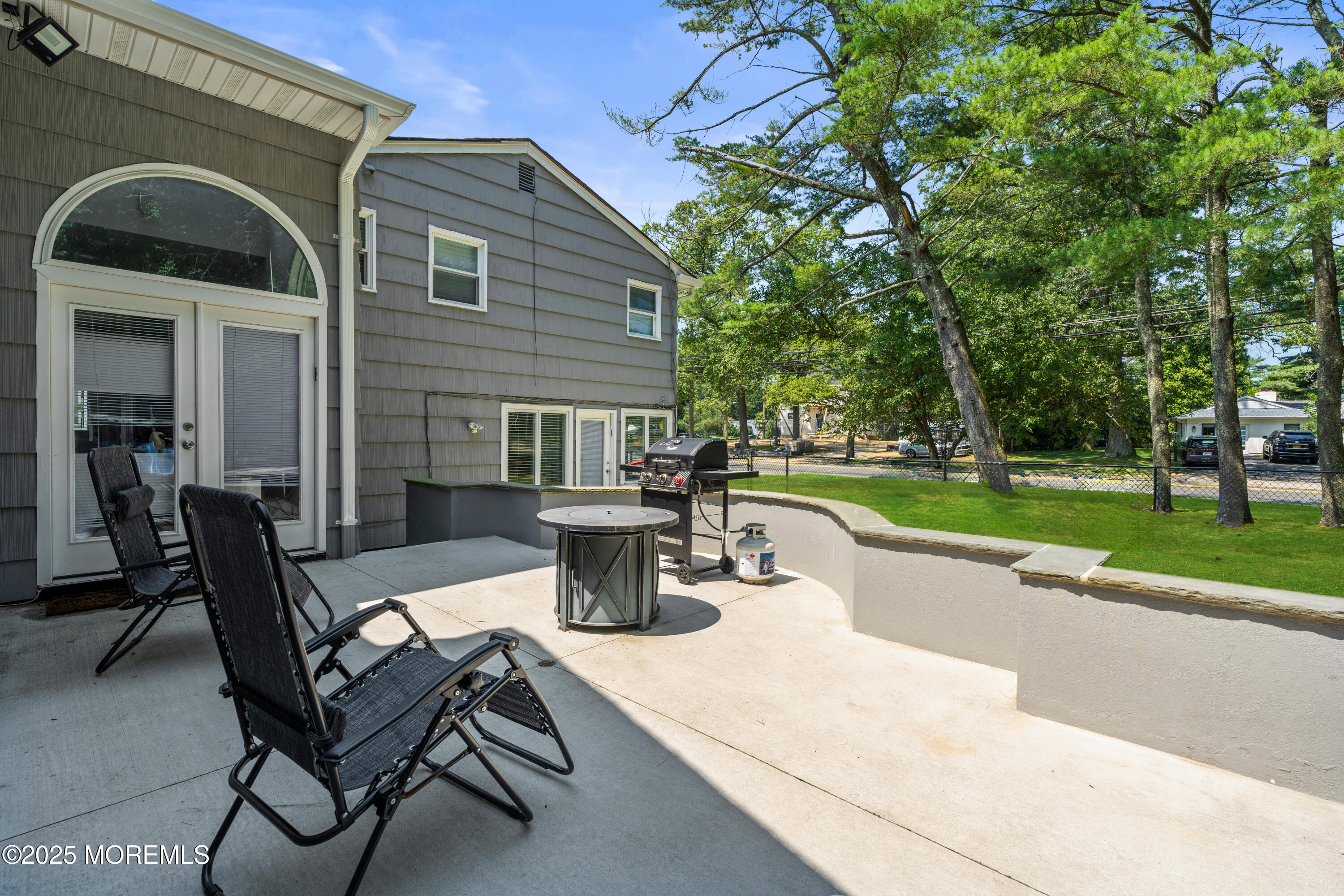 460 Runyan Avenue Deal, NJ 07723 - Photo 30 of 30 a view of a patio with table and chairs and a barbeque