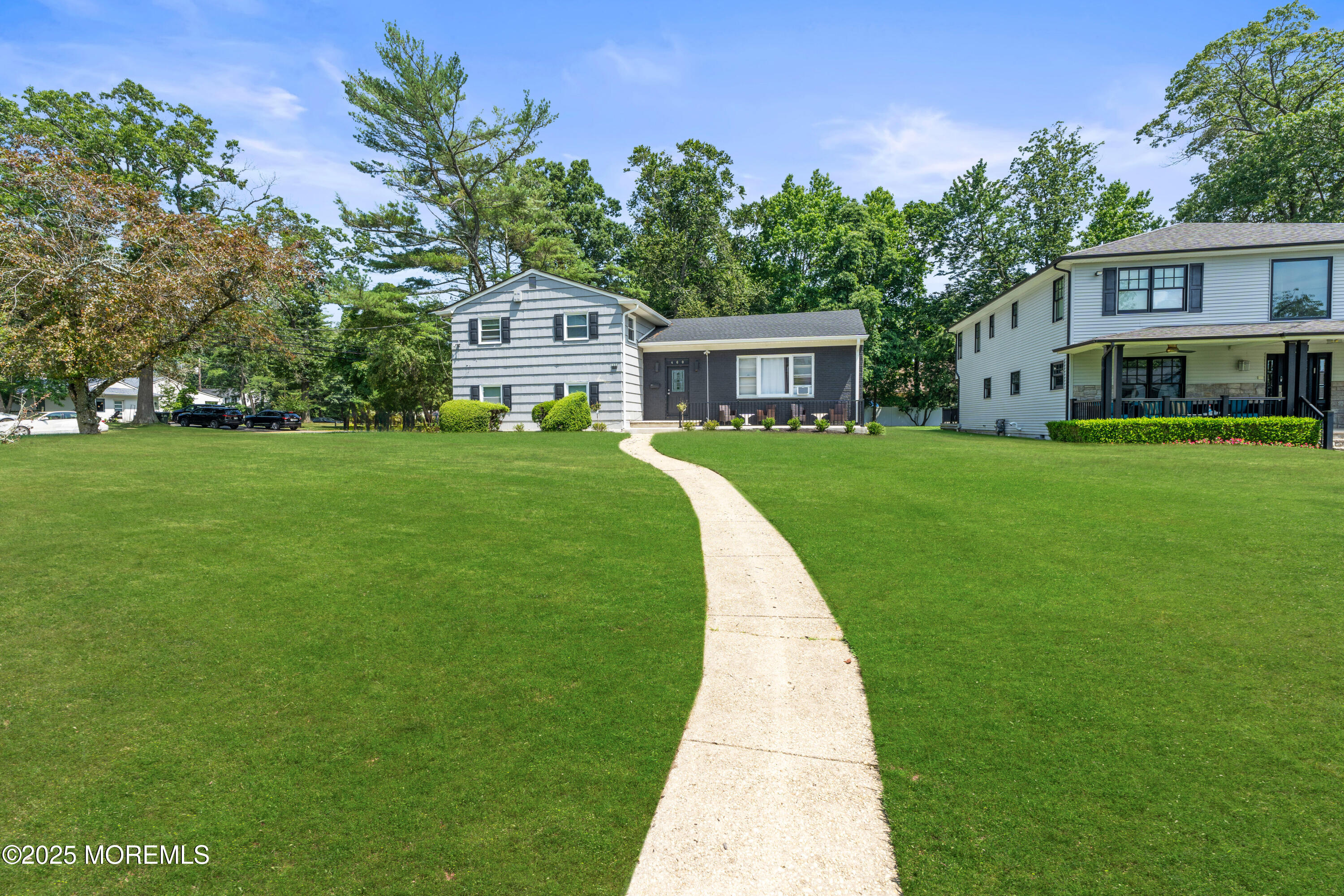 460 Runyan Avenue Deal, NJ 07723 - Photo 3 of 30 a front view of a house with garden