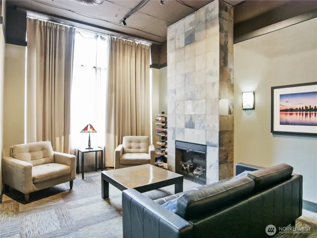 a living room with furniture and a fireplace