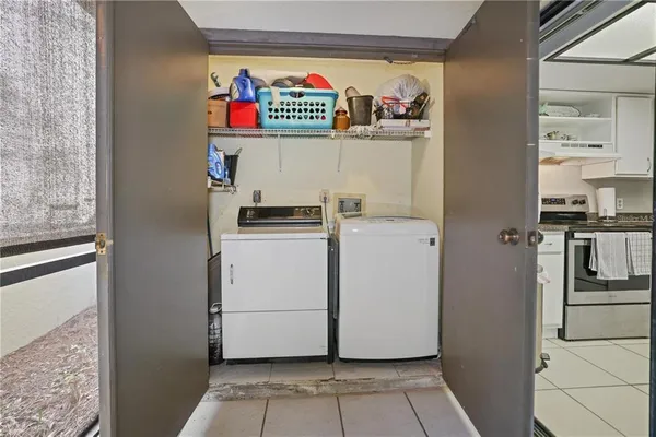 a utility room with dryer and washer