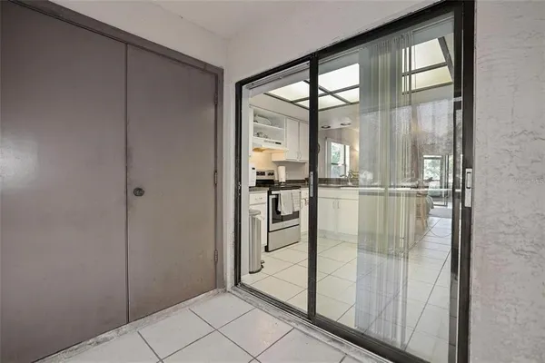 a bathroom with a glass shower door