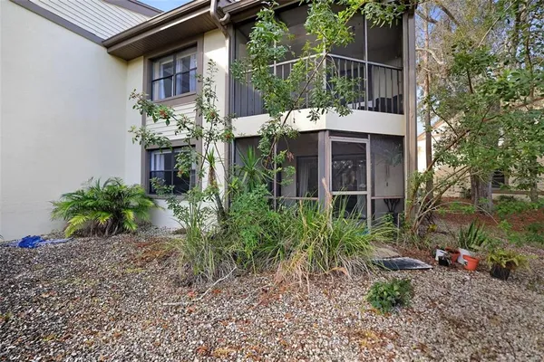 a view of a backyard with swimming pool