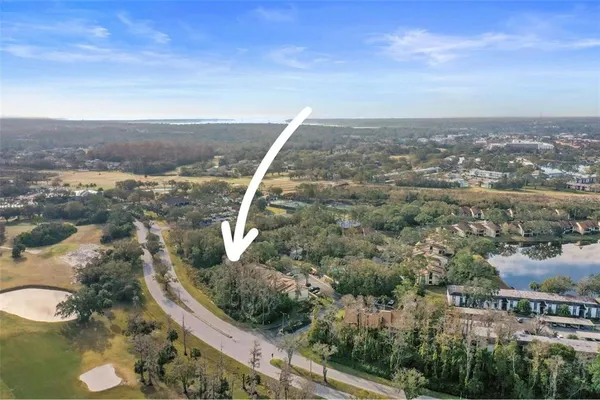 an aerial view of residential building and green space