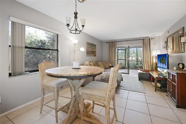 a view of a dining room with furniture window and outside view