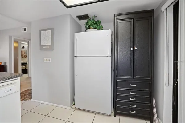 a view of walk in closet with clothes