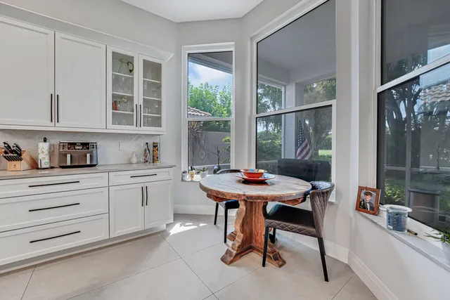 a bathroom with a toilet a sink and a mirror