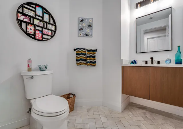 a spacious bedroom with a bed and a chandelier