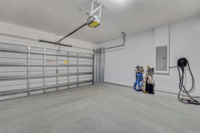 a bedroom with furniture and large windows