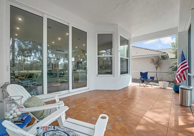 a view of a chair and tables in the backyard