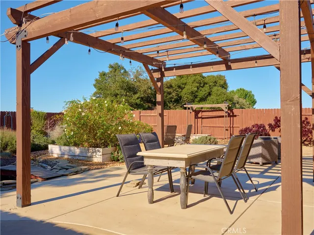 a patio with a yard table and chairs