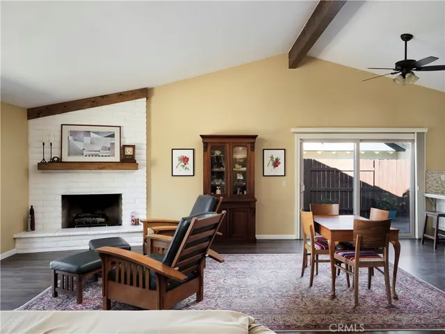 a living room with furniture a rug and a fireplace