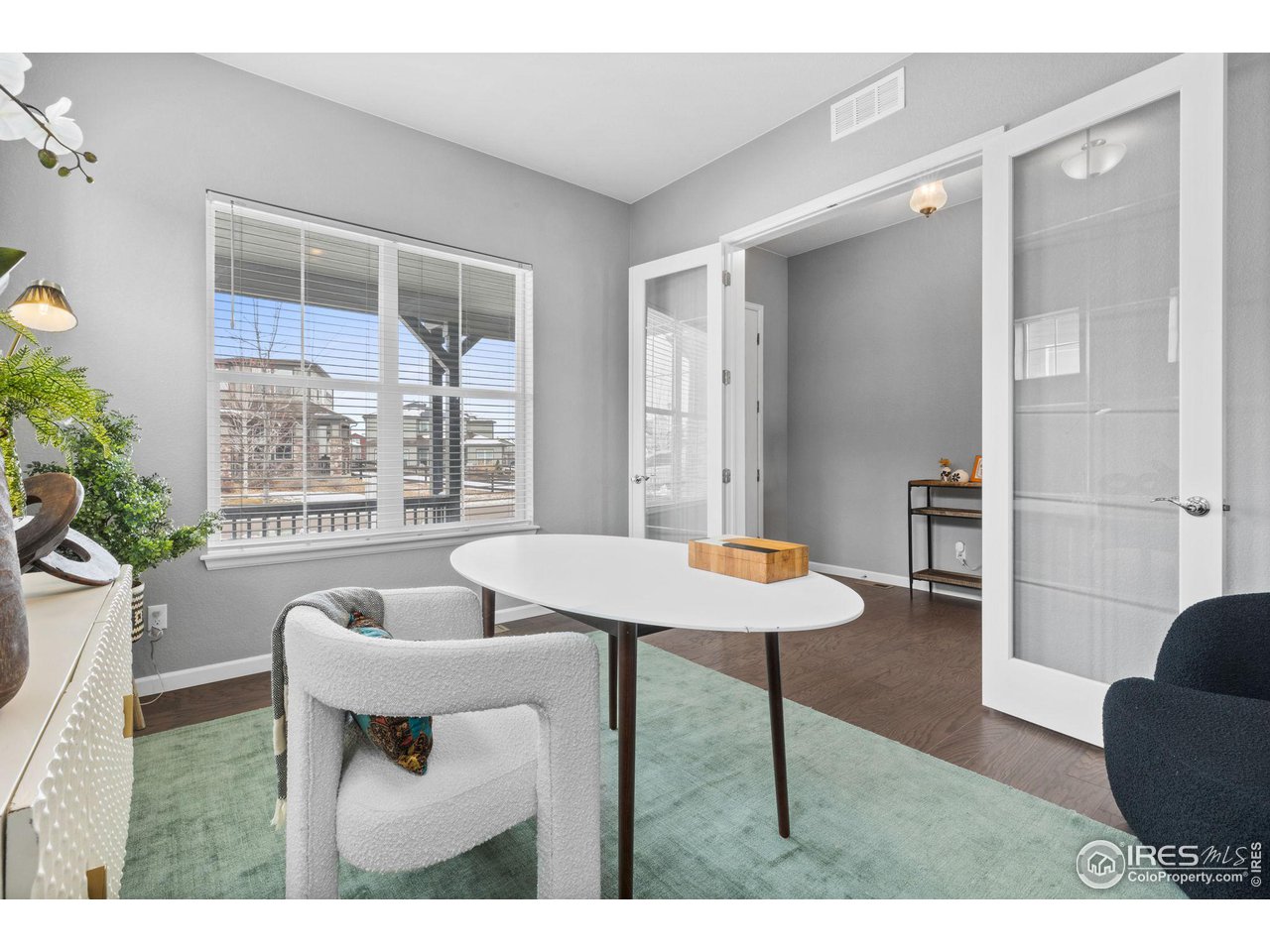 973 Stagecoach Drive Lafayette, CO 80026 - Photo 12 of 39 a view of a dining room with furniture and a potted plant