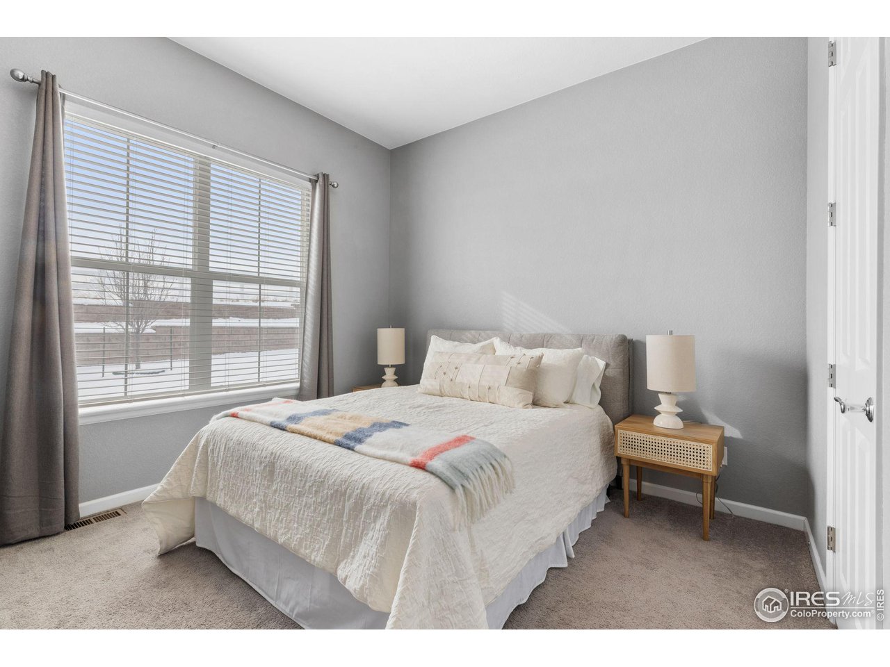 973 Stagecoach Drive Lafayette, CO 80026 - Photo 16 of 39 a bedroom with a bed and a window