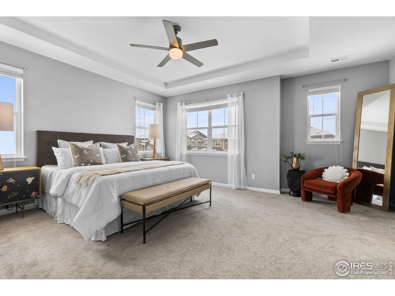 973 Stagecoach Drive Lafayette, CO 80026 - Photo 18 of 39 a bedroom with a bed a couch and a window