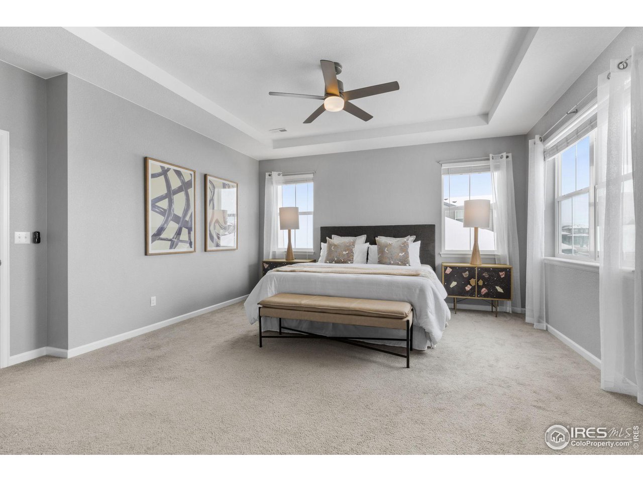 973 Stagecoach Drive Lafayette, CO 80026 - Photo 19 of 39 a bedroom with a bed mirror and a window