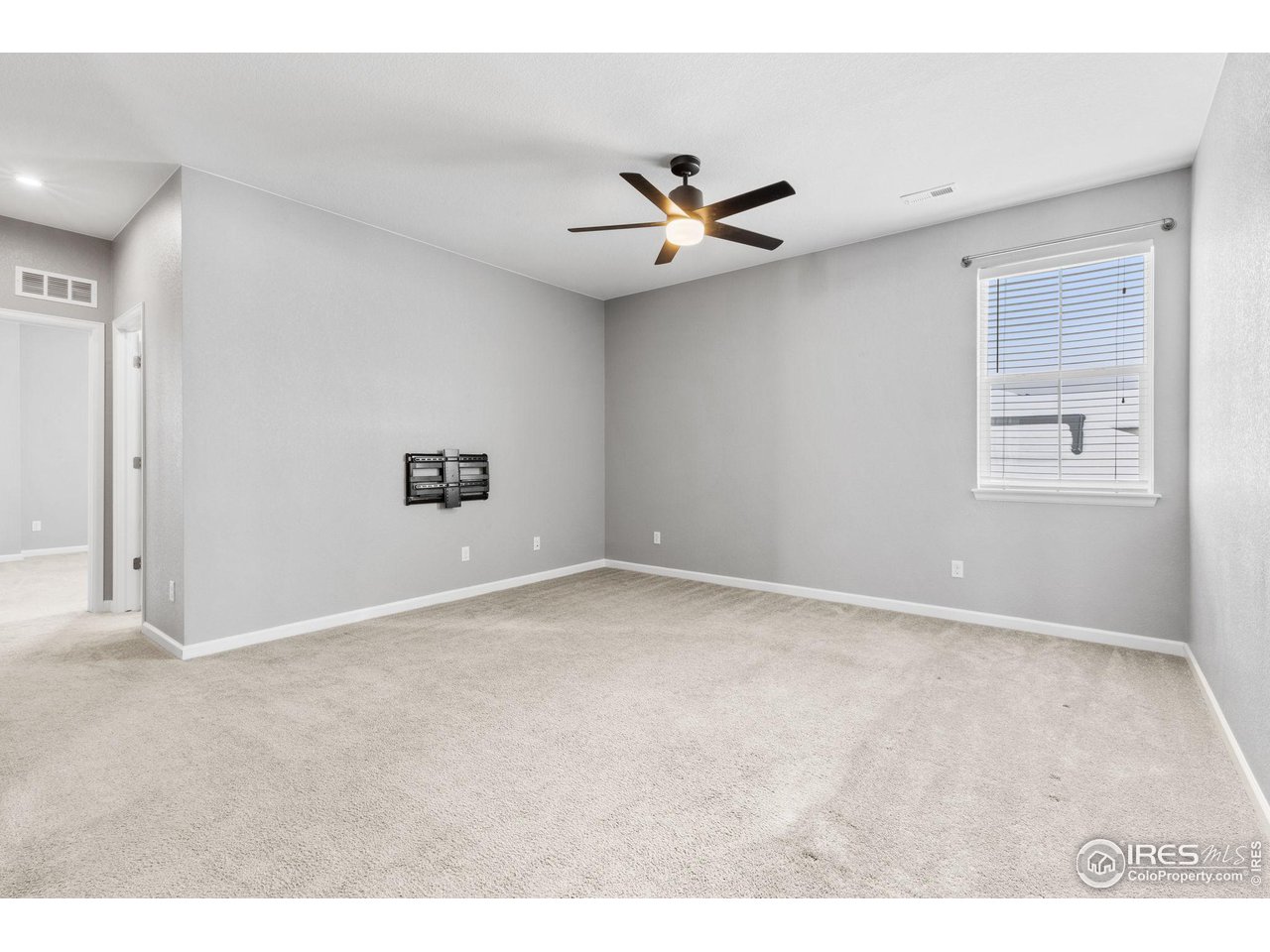 973 Stagecoach Drive Lafayette, CO 80026 - Photo 21 of 39 a view of an empty room with a window