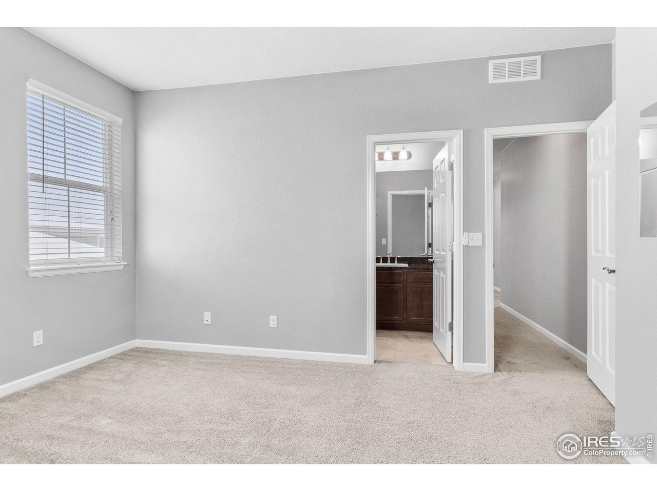 973 Stagecoach Drive Lafayette, CO 80026 - Photo 22 of 39 a view of an empty room with a window
