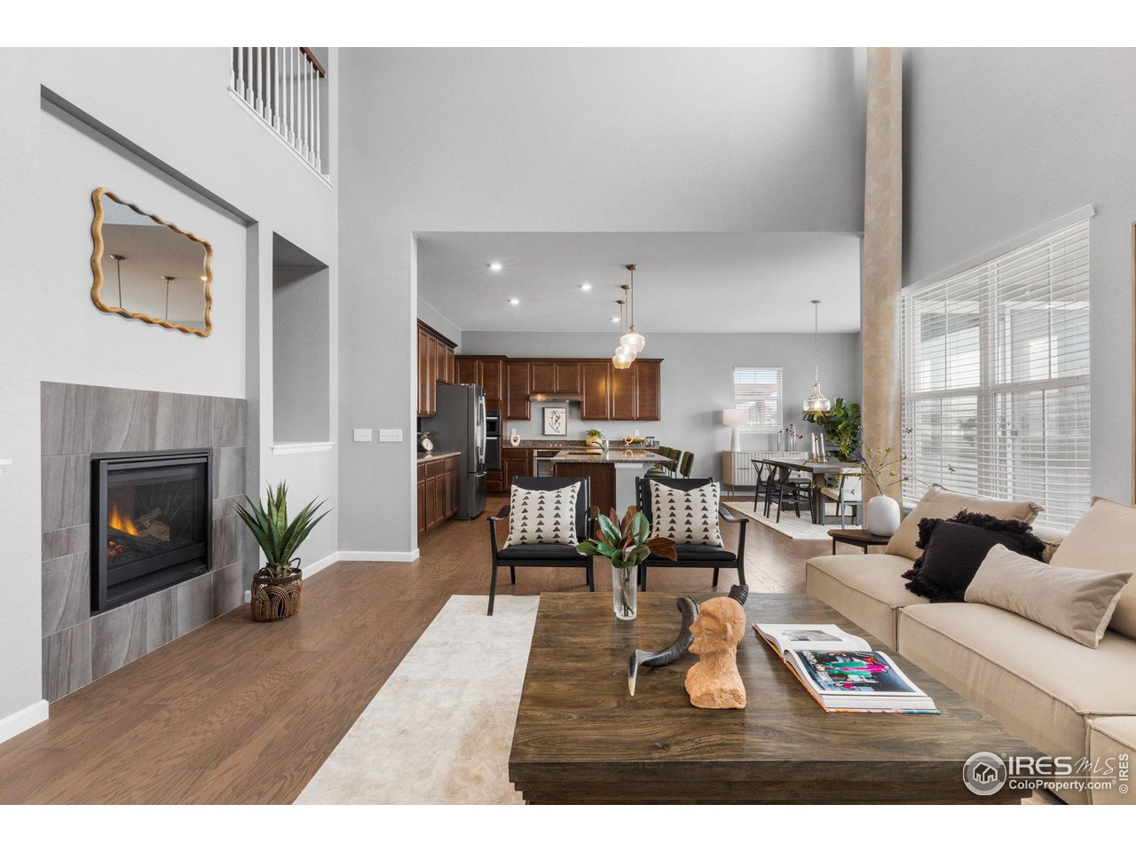 973 Stagecoach Drive Lafayette, CO 80026 - Photo 5 of 39 a living room with furniture large window and a fireplace