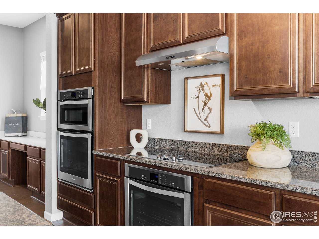 973 Stagecoach Drive Lafayette, CO 80026 - Photo 7 of 39 a kitchen with granite countertop stainless steel appliances and cabinets