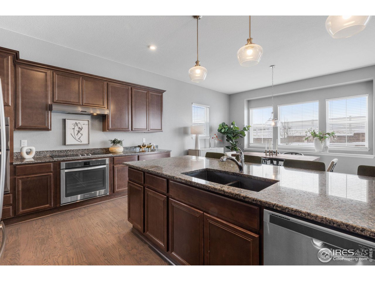 973 Stagecoach Drive Lafayette, CO 80026 - Photo 8 of 39 a kitchen with a sink stainless steel appliances and cabinets
