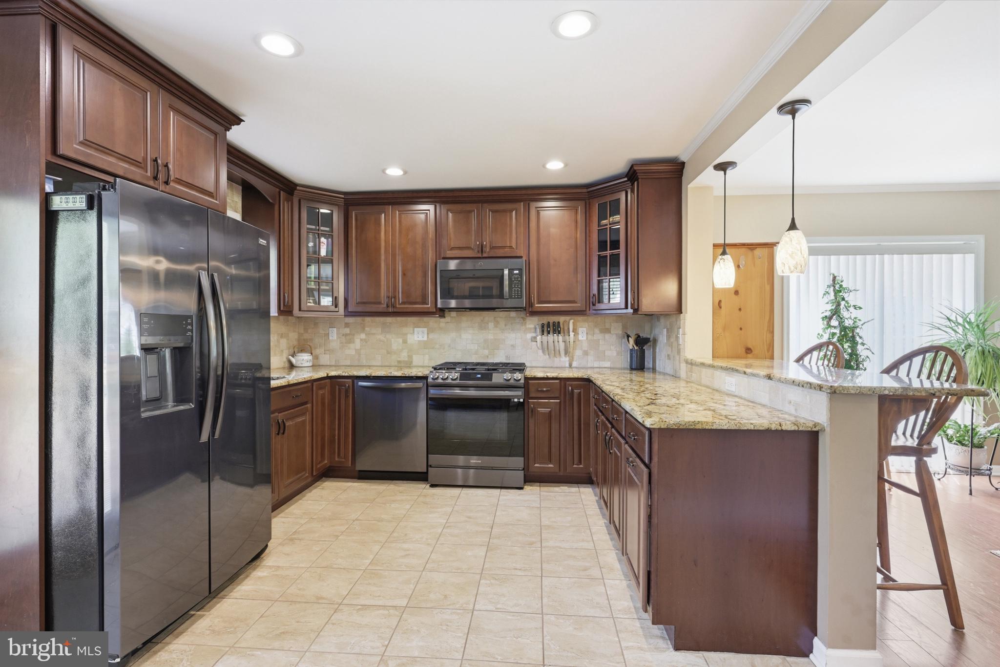 768 Salem Church Road Newark, DE 19702 - Photo 12 of 42 Elegant kitchen with rich wood tones.