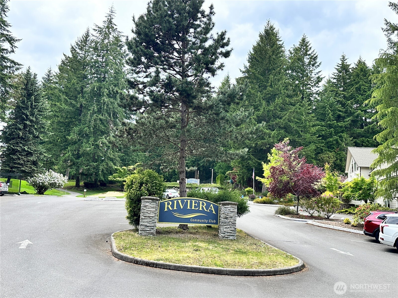 10412 Edgewood Drive Anderson Island, WA 98303 - Photo 3 of 16 a view of a house with a fountain in front of it