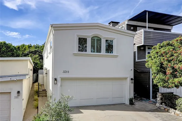 a front view of a house with a garage