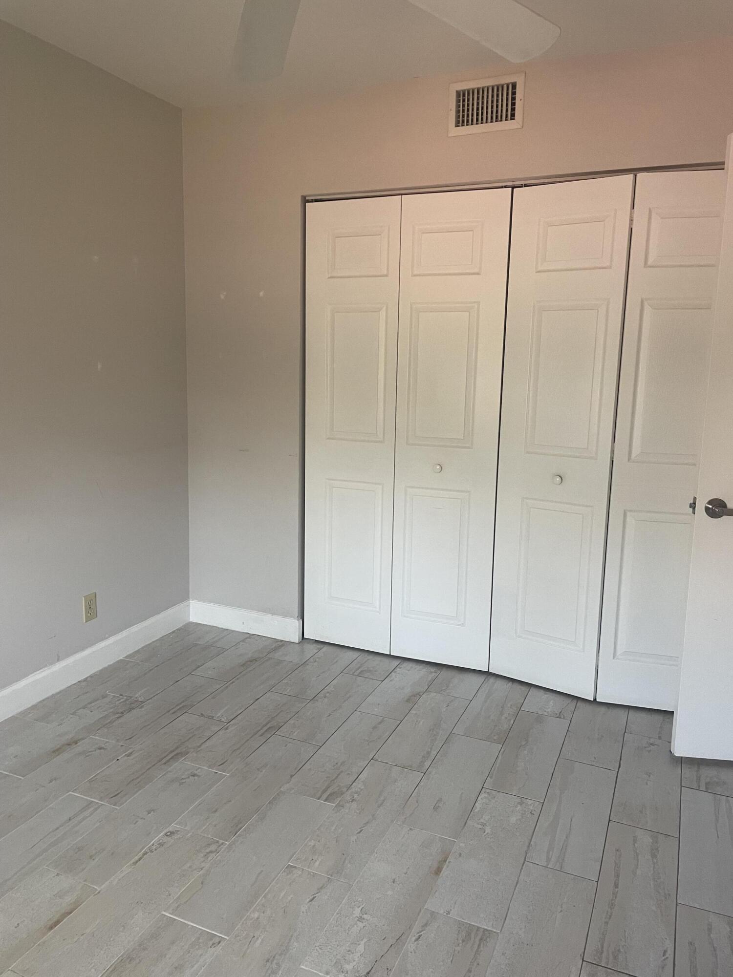 18258 Covina Way, Unit 102 Boca Raton, FL 33498 - Photo 11 of 14 a view of an empty room